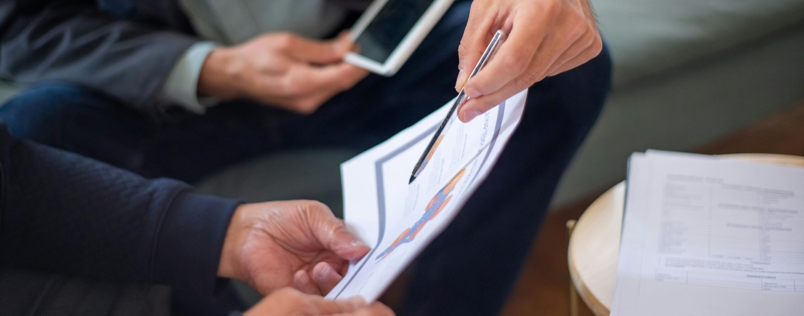 Image of two people looking at CARMA-H2 leaflet